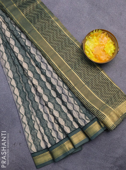 Malai silk saree brige and dark green with allover prints and zari woven border