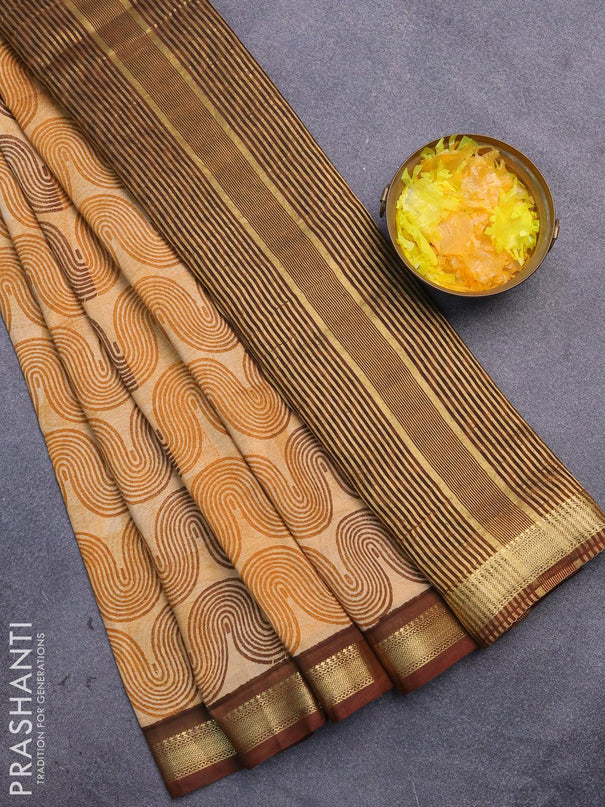 Malai silk saree mustard shade and brown with allover zig zag prints and zari woven border