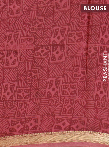 Malai silk saree maroon with allover prints and zari woven border