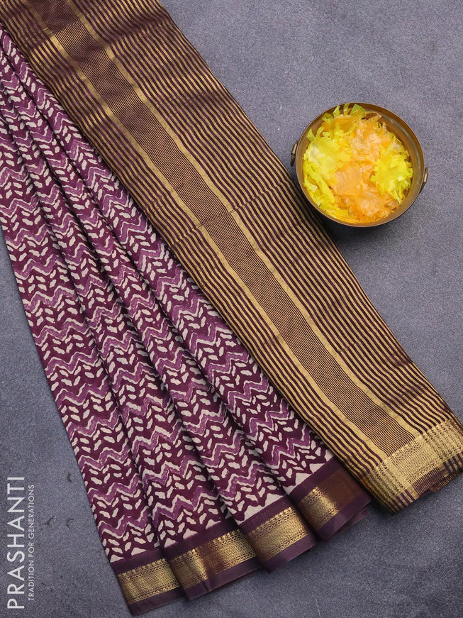 Malai silk saree jamun shade and deep jamun with allover prints and zari woven border