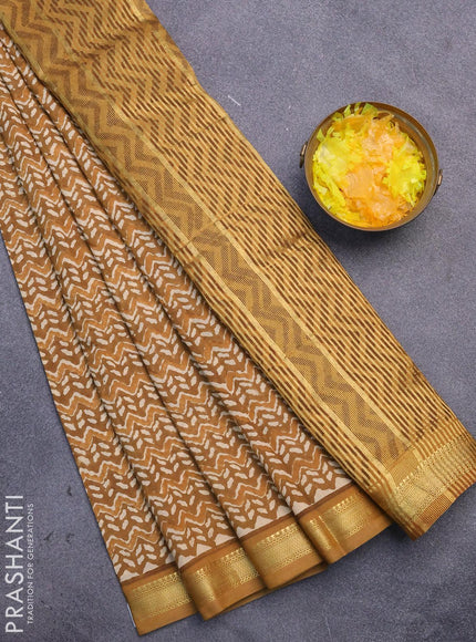 Malai silk saree dark mustard and mustard shade with allover prints and zari woven border