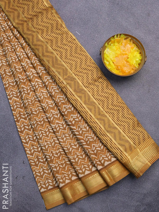 Malai silk saree dark mustard and mustard shade with allover prints and zari woven border