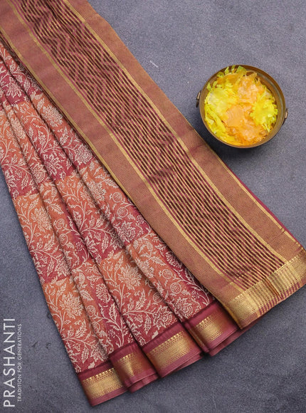 Malai silk saree rust shade and pastel maroon with allover floral prints and zari woven border