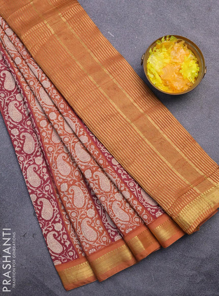 Malai silk saree dark pink and rust shade with allover paisley prints and zari woven border