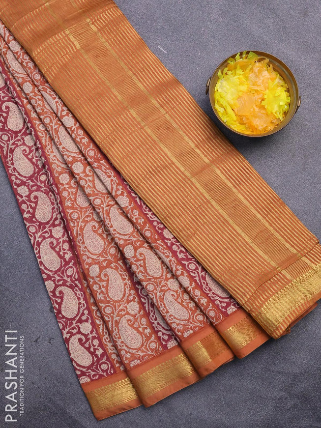 Malai silk saree dark pink and rust shade with allover paisley prints and zari woven border