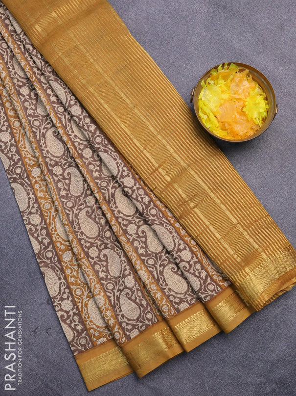 Malai silk saree brown and dark mustard with allover paisley prints and zari woven border