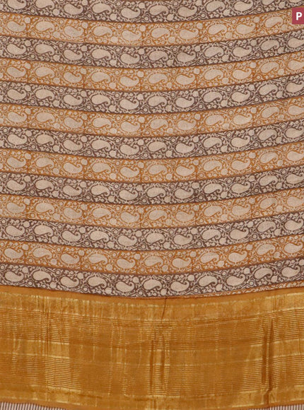 Malai silk saree brown and dark mustard with allover paisley prints and zari woven border