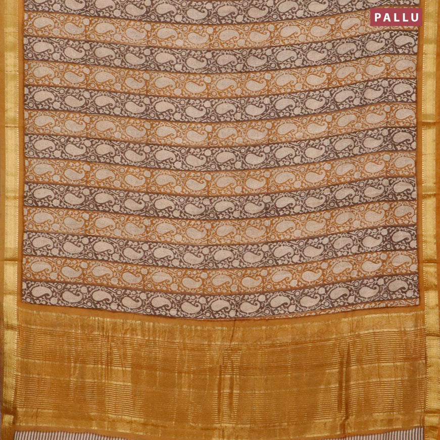 Malai silk saree brown and dark mustard with allover paisley prints and zari woven border