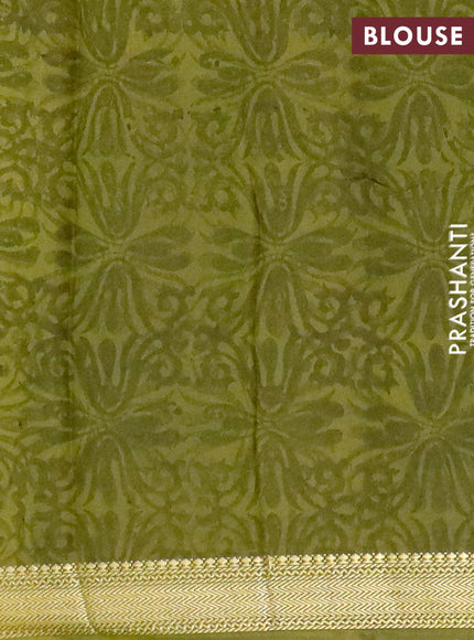 Malai silk saree dark green and mehendi green with allover paisley prints and zari woven border