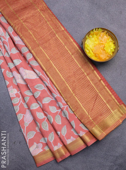 Malai silk saree peach shade with allover prints and zari woven border