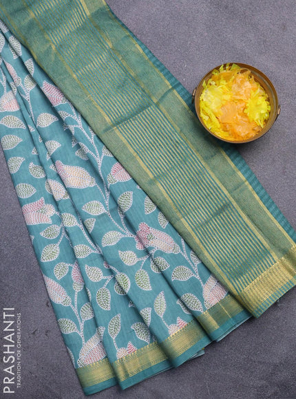 Malai silk saree teal blue shade with allover prints and zari woven border