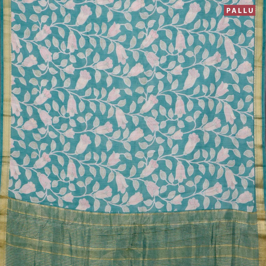 Malai silk saree teal blue shade with allover prints and zari woven border