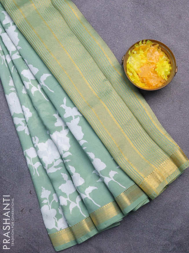 Malai silk saree pastel green with allover floral prints and zari woven border