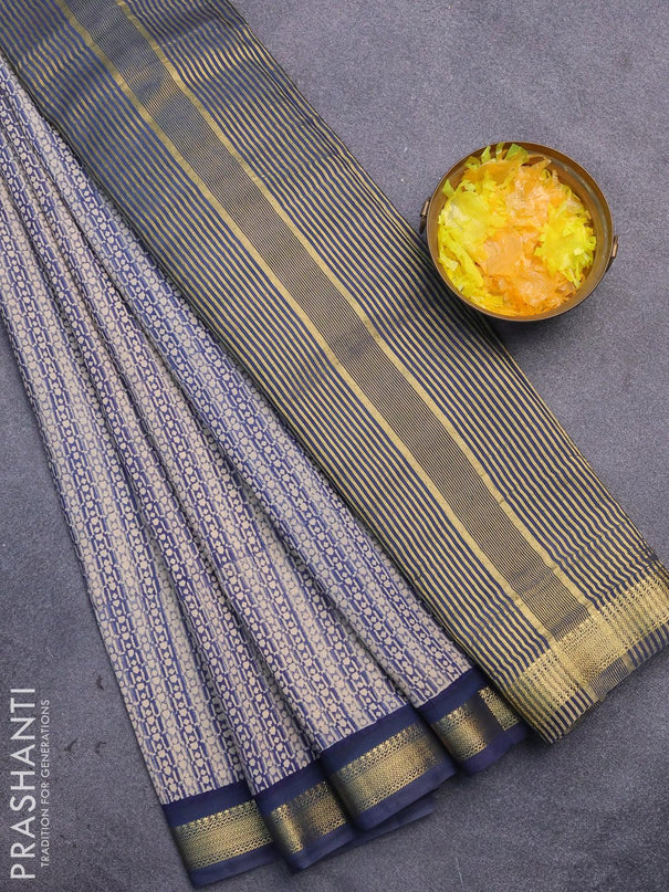 Malai silk saree beige and blue with allover prints and zari woven border