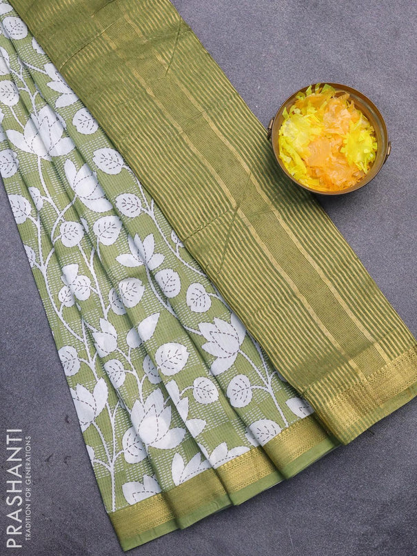 Malai silk saree green shade and off white with allover floral prints and zari woven border