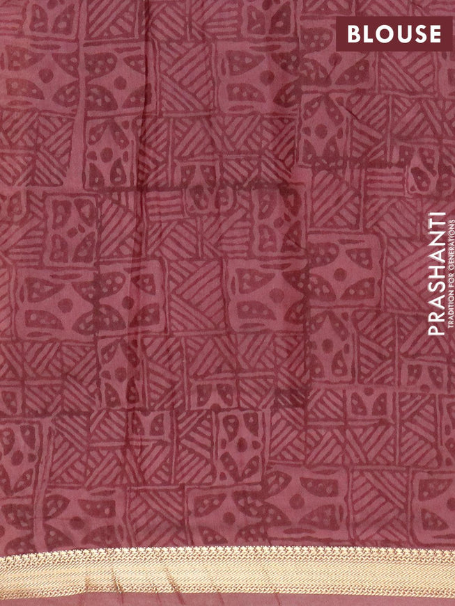 Malai silk saree pastel maroon shade with allover prints and zari woven border