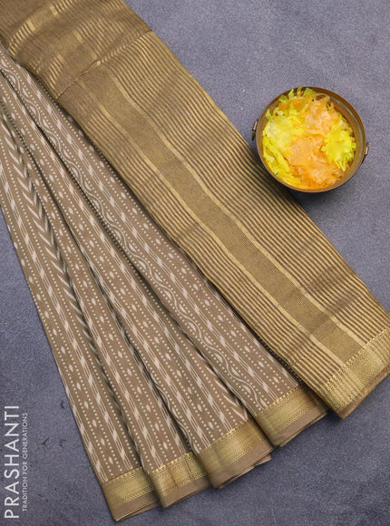 Malai silk saree khaki shade with allver ikat prints and zari woven border