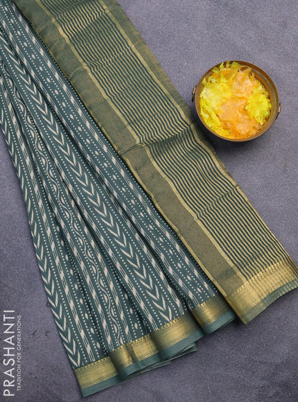 Malai silk saree dark green shade with allver ikat prints and zari woven border