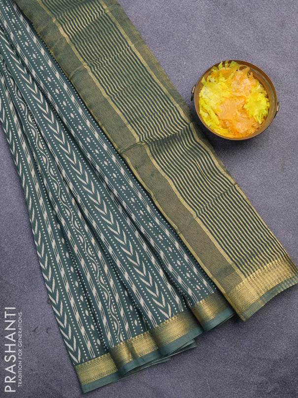 Malai silk saree dark green shade with allver ikat prints and zari woven border