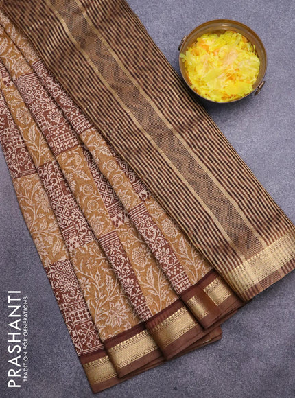 Malai silk saree khaki shade and brown with allover prints and zari woven border