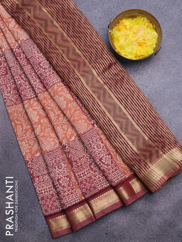 Malai silk saree rust shade and maroon with allover prints and zari woven border