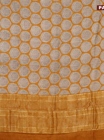 Malai silk saree dark mustard with allover butta prints and zari woven border