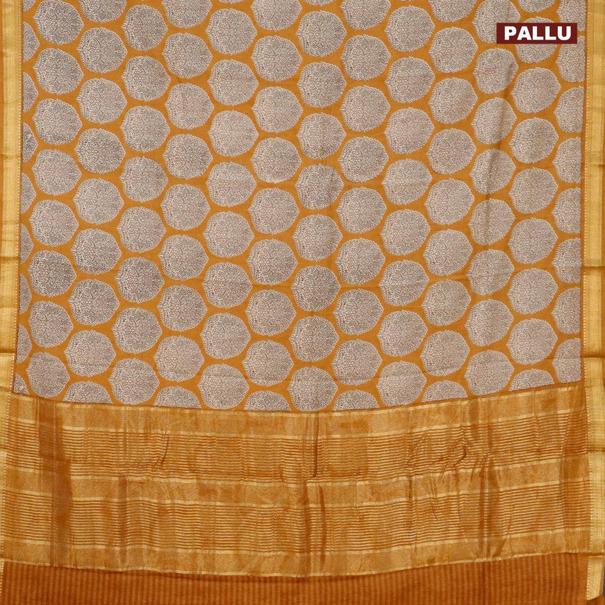 Malai silk saree dark mustard with allover butta prints and zari woven border