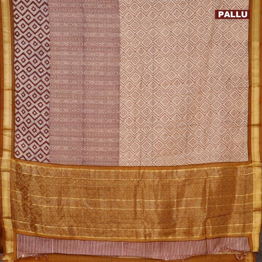 Malai silk saree beige maroon and dark mustard with allover prints and zari woven border