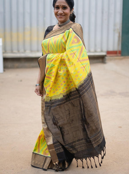 Ikat soft silk saree yellow and black with allover ikat weaves and zari woven border