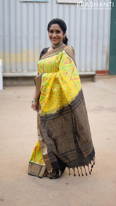 Ikat soft silk saree yellow and black with allover ikat weaves and zari woven border