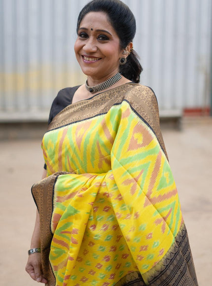 Ikat soft silk saree yellow and black with allover ikat weaves and zari woven border