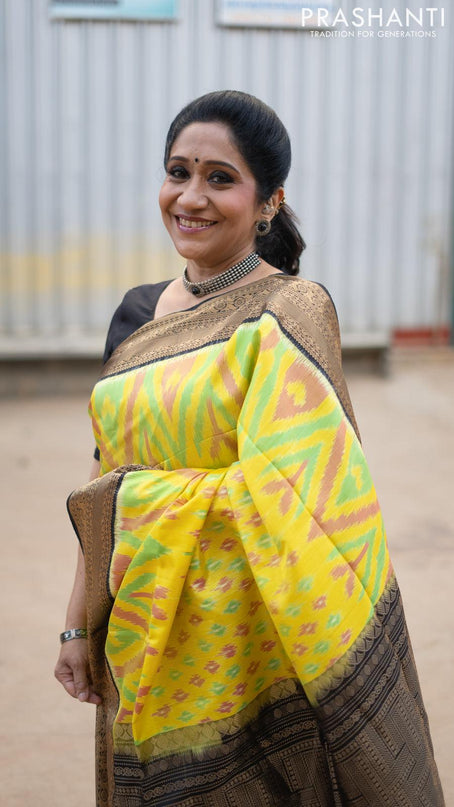 Ikat soft silk saree yellow and black with allover ikat weaves and zari woven border