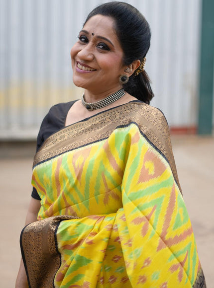 Ikat soft silk saree yellow and black with allover ikat weaves and zari woven border