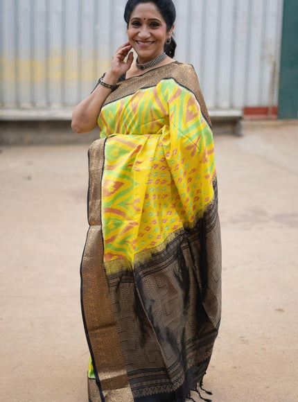 Ikat soft silk saree yellow and black with allover ikat weaves and zari woven border