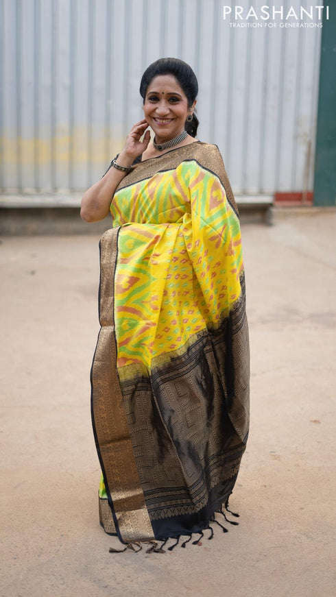 Ikat soft silk saree yellow and black with allover ikat weaves and zari woven border