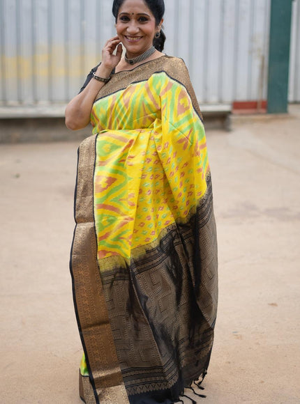 Ikat soft silk saree yellow and black with allover ikat weaves and zari woven border