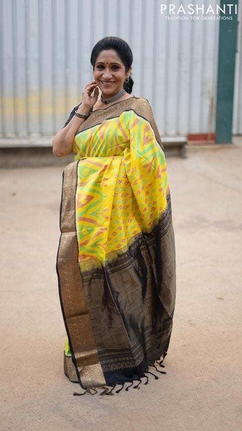 Ikat soft silk saree yellow and black with allover ikat weaves and zari woven border