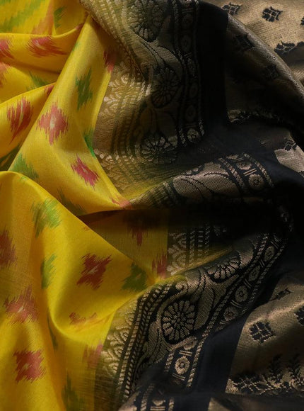 Ikat soft silk saree yellow and black with allover ikat weaves and zari woven border