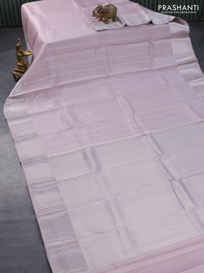 Pure kanjivaram silk saree pastel pink shade with silver zari woven 1000 buttas and rich silver zari woven border