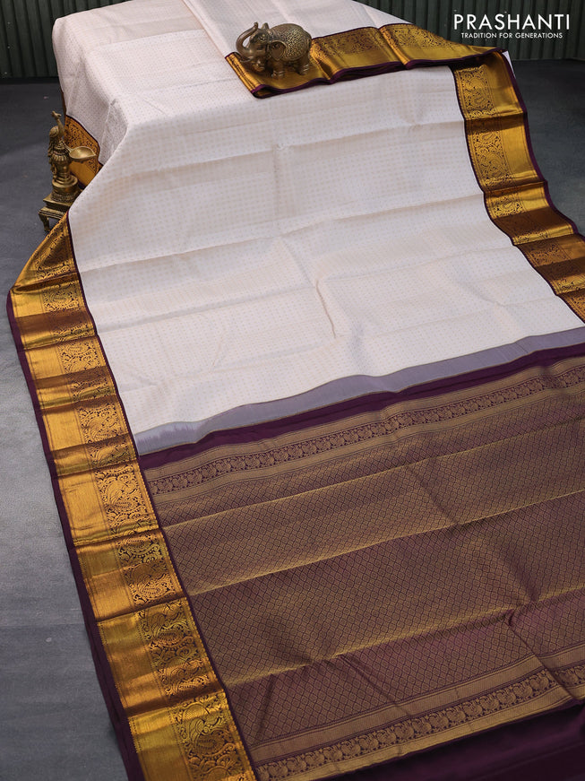 Pure kanjivaram silk saree cream and wine shade with allover self emboss & 1000 buttas and annam zari woven border