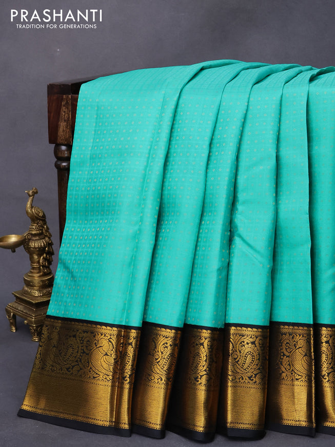 Pure kanjivaram silk saree teal blue and black with allover self emboss & 1000 buttas and annam zari woven border