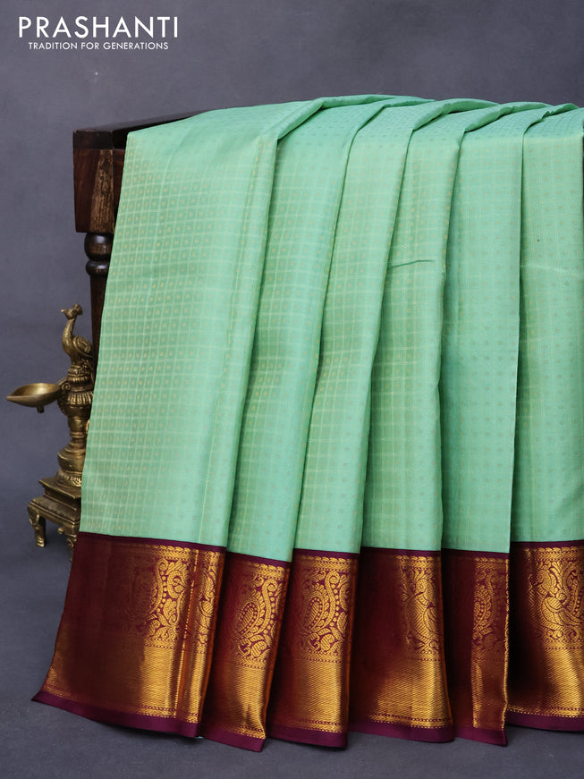 Pure kanjivaram silk saree pastel green and wine shade with allover self emboss & 1000 buttas and annam zari woven border
