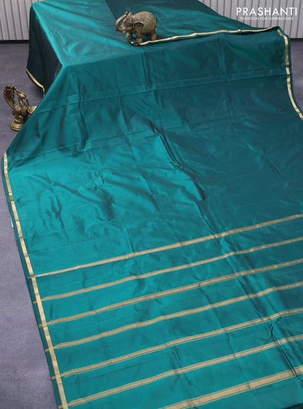 Kanjivaram silk saree green with plain body and small zari woven border