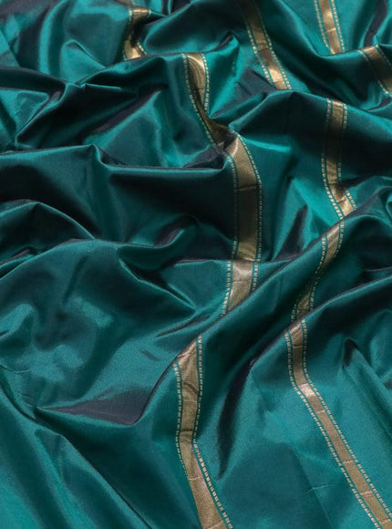 Kanjivaram silk saree green with plain body and small zari woven border