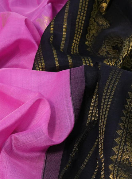 Silk cotton saree light pink and black with paecock zari woven buttas and peacock zari woven korvai border