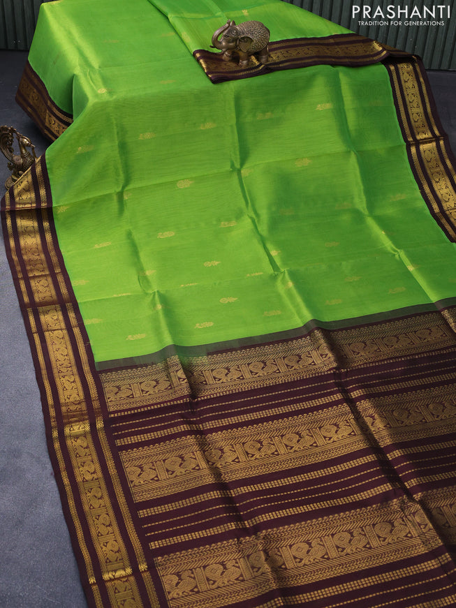 Silk cotton saree light green and coffee brown with zari woven buttas and annam zari woven korvai border