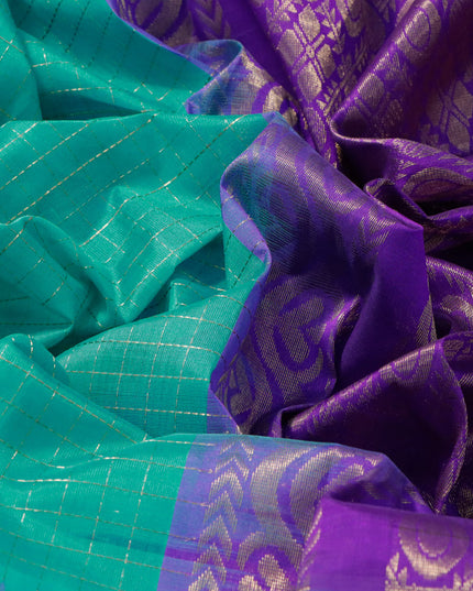 Kuppadam silk cotton saree teal blue and deep violet with allover zari checked pattern and temple design zari woven butta border