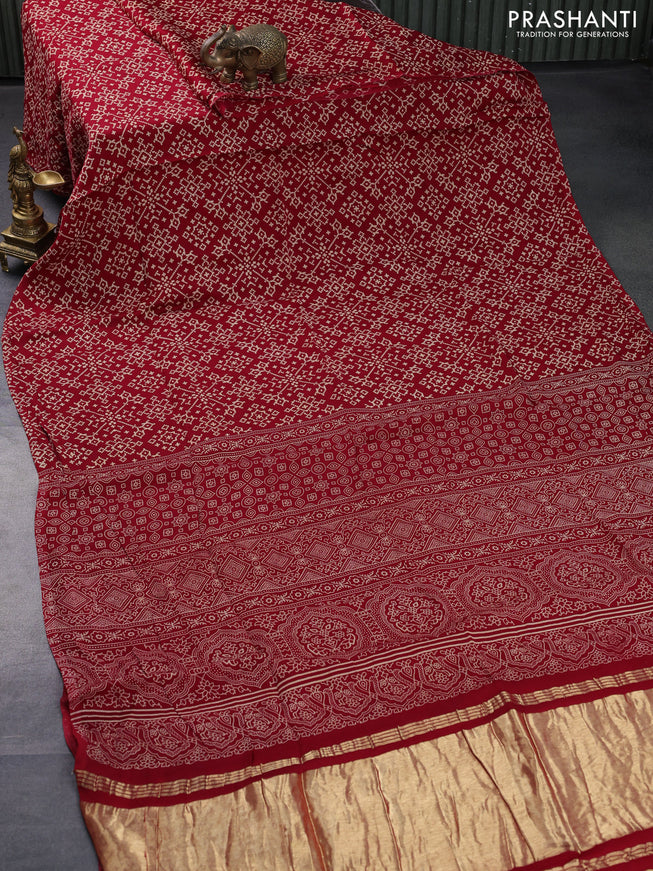 Modal silk saree red with allover ikat prints and ajrakh printed pallu