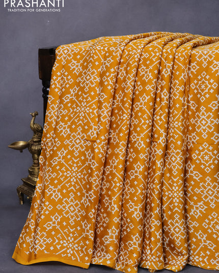Modal silk saree mustard yellow with allover ikat prints and ajrakh printed pallu