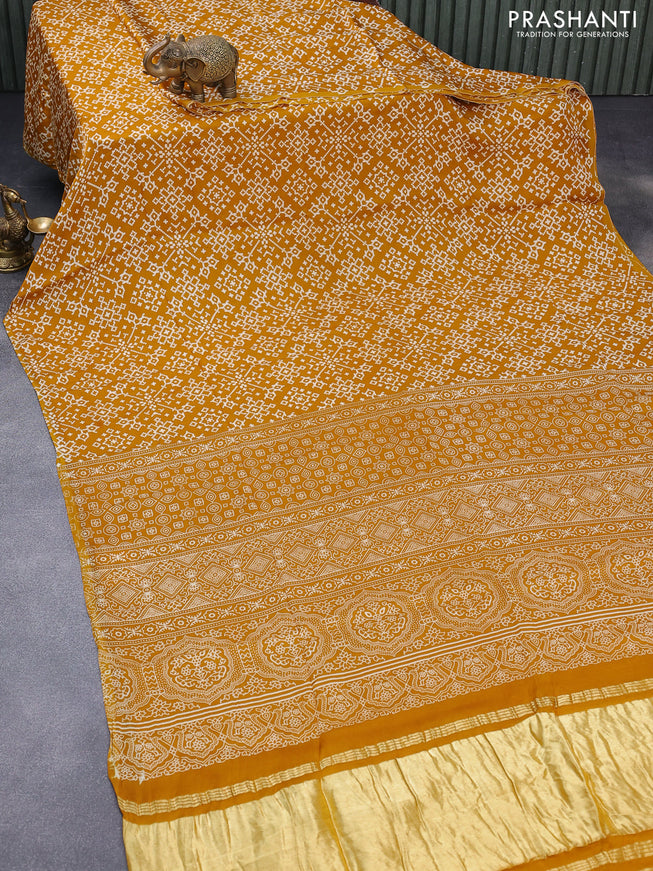 Modal silk saree mustard yellow with allover ikat prints and ajrakh printed pallu
